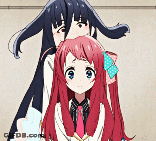 A Girl With Long Black Hair Is Standing Next To Another Girl With Pink Hair GIF