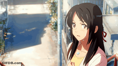 A Girl With Long Black Hair Is Wearing A Yellow Shirt GIF