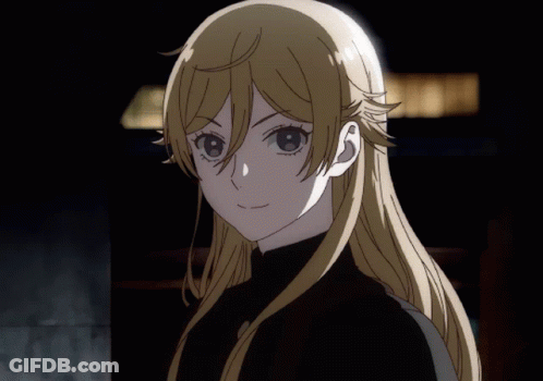 A Girl With Long Blonde Hair Is Wearing A Black Sweater GIF