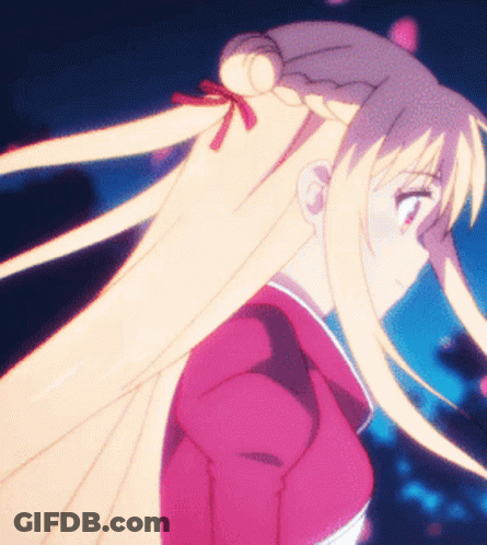 A Girl With Long Blonde Hair Is Wearing A Pink Shirt GIF
