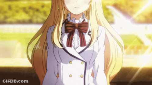 A Girl With Long Blonde Hair Is Wearing A White Jacket And A Bow Tie GIF