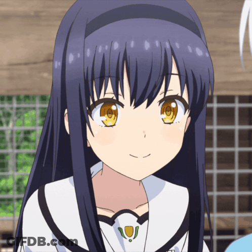 A Girl With Long Blue Hair And Yellow Eyes Smiles For The Camera GIF