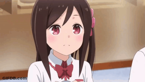 A Girl With Long Brown Hair And A Red Bow Tie Is Looking At The Camera . GIF