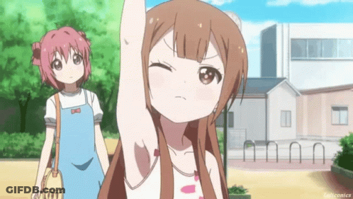 A Girl With Long Brown Hair Is Raising Her Arm In The Air While Another Girl Looks On GIF