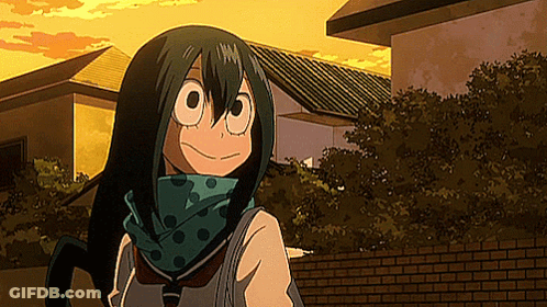 A Girl With Long Green Hair And A Scarf Around Her Neck Is Standing In Front Of A Building . GIF