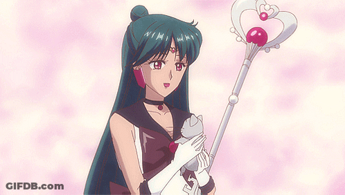 A Girl With Long Hair Is Holding A Cat And A Wand With A Heart On It GIF