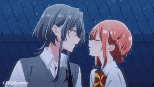 A Girl With Long Hair Is Kissing A Girl With Red Hair GIF