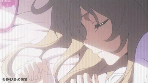 A Girl With Long Hair Is Laying On A Bed GIF