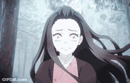 A Girl With Long Hair Is Walking Through A Forest . GIF