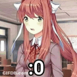 A Girl With Long Red Hair And Green Eyes Is Standing In A Classroom Wearing A School Uniform . GIF