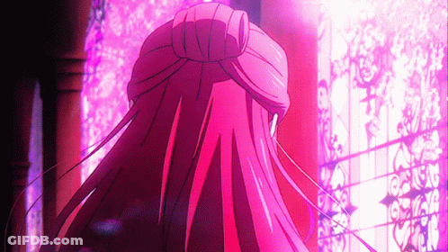 A Girl With Long Red Hair Is Standing In Front Of A Window GIF