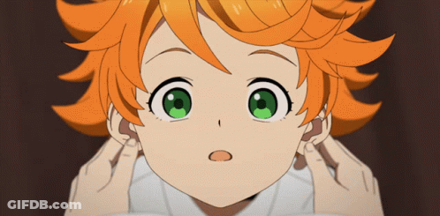 A Girl With Orange Hair And Green Eyes Covering Her Ears With Her Hands GIF