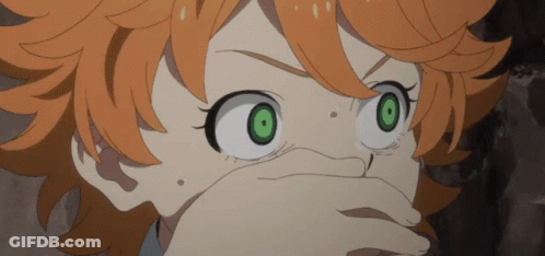 A Girl With Orange Hair And Green Eyes Is Covering Her Mouth GIF
