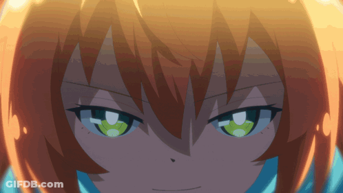 A Girl With Orange Hair And Green Eyes Looks At The Camera GIF