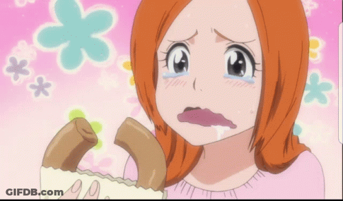 A Girl With Orange Hair Is Crying While Holding A Piece Of Food GIF