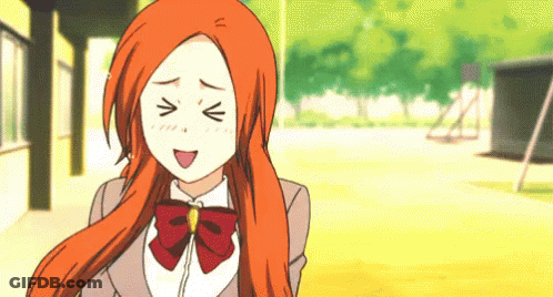 A Girl With Orange Hair Is Making A Funny Face With Her Eyes Closed GIF