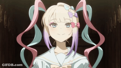 A Girl With Pigtails And A Bow In Her Hair Looks At The Camera GIF