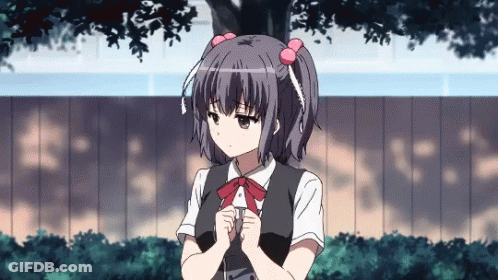 A Girl With Pigtails And A Bow Tie Is Standing In Front Of A Fence GIF
