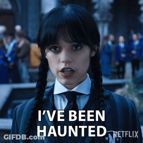 A Girl With Pigtails And A Suit Says I 'Ve Been Haunted GIF