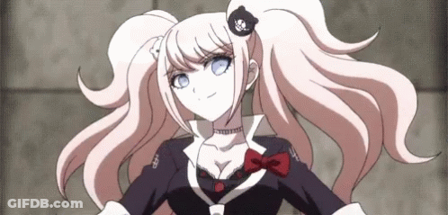 A Girl With Pigtails And Blue Eyes Is Wearing A Black And White Outfit GIF