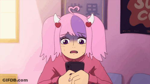 A Girl With Pigtails And Horns Looks At Her Phone GIF