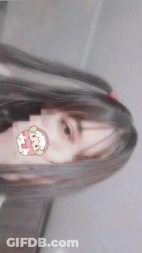 A Girl With Pigtails Has A Sticker On Her Face That Says ' Sheep ' On It GIF