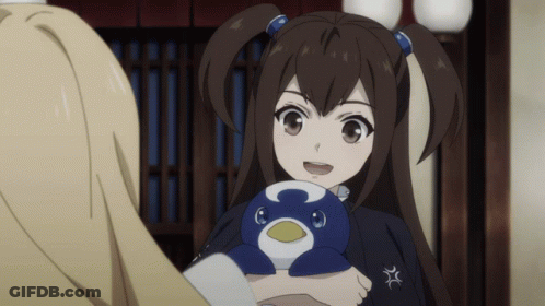 A Girl With Pigtails Is Holding A Stuffed Penguin With The Letter C On It GIF