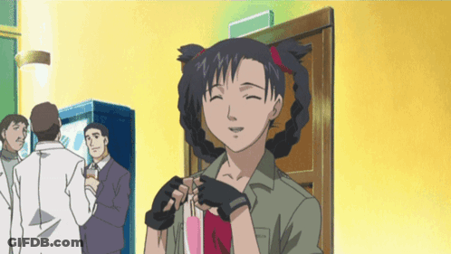 A Girl With Pigtails Is Smiling And Holding A Pink Item GIF