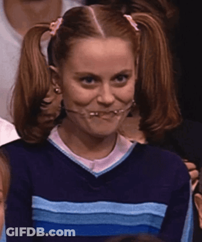 A Girl With Pigtails Is Wearing A Blue And White Striped Sweater GIF