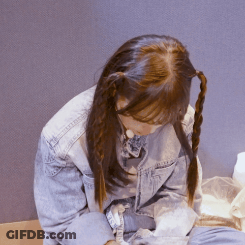 A Girl With Pigtails Is Wearing A Denim Jacket That Says ' Denim ' On The Sleeve GIF