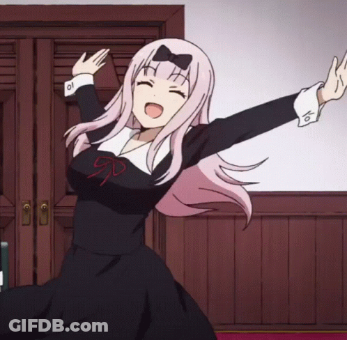 A Girl With Pink Hair And A Bow On Her Head Is Dancing GIF