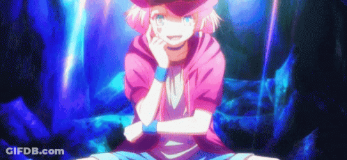 A Girl With Pink Hair And A Hat Is Sitting On The Ground With Her Arms Crossed And Smiling . GIF
