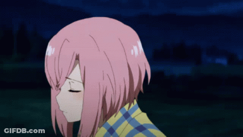 A Girl With Pink Hair And A Plaid Shirt Looks Down GIF