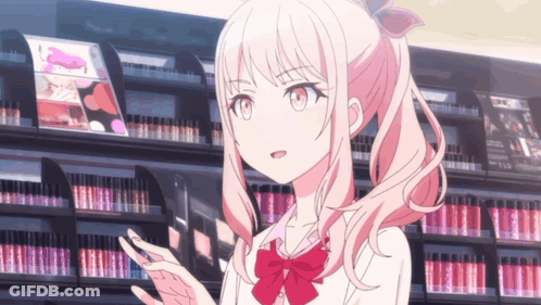 A Girl With Pink Hair And A Red Bow Is Standing In Front Of A Shelf Of Lipsticks GIF