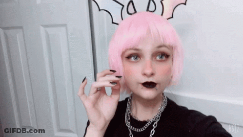 A Girl With Pink Hair And Black Nails Is Taking A Picture With B612 GIF