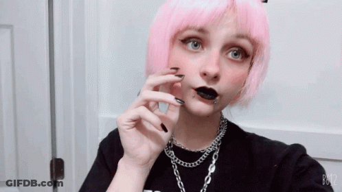 A Girl With Pink Hair And Black Nails Is Taking A Selfie With B612 GIF
