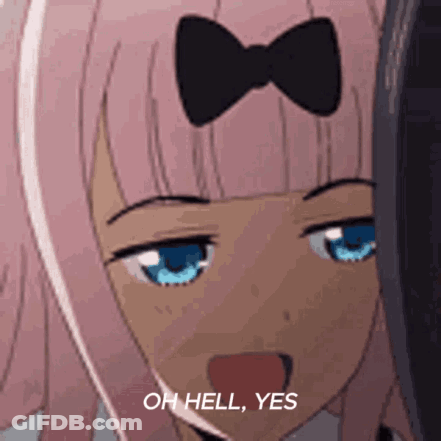 A Girl With Pink Hair And Blue Eyes Is Making A Funny Face . GIF