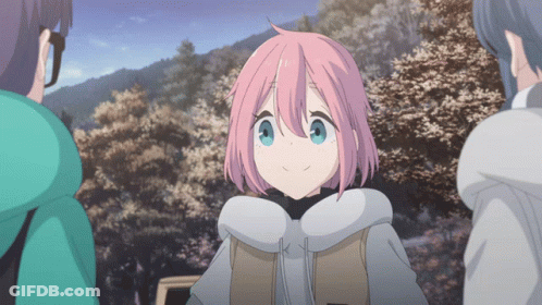 A Girl With Pink Hair And Blue Eyes Is Surrounded By Other Girls GIF