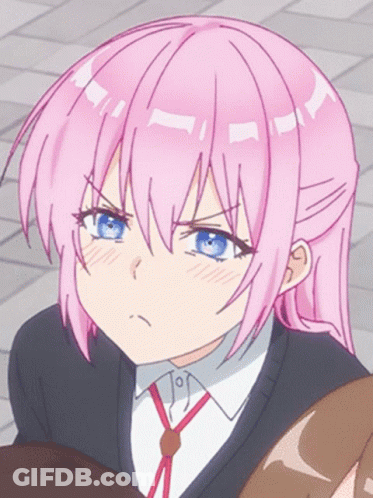 A Girl With Pink Hair And Blue Eyes Making A Funny Face GIF