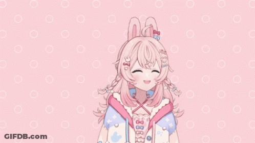 A Girl With Pink Hair And Bunny Ears Is Smiling GIF