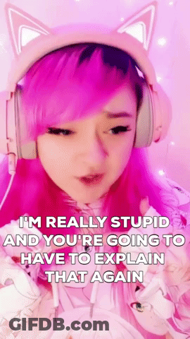 A Girl With Pink Hair And Cat Ears Is Wearing Headphones And Making A Face . GIF