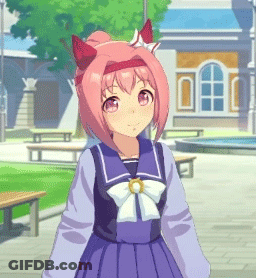A Girl With Pink Hair And Red Ears Is Wearing A Sailor Uniform And Standing In Front Of A Building . GIF