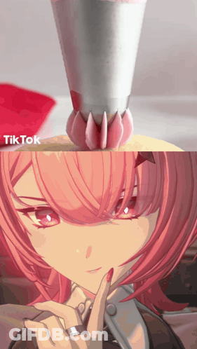 A Girl With Pink Hair Has A Ring On Her Finger And Is Being Decorated With Icing GIF