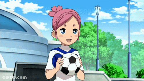 A Girl With Pink Hair Holding A Soccer Ball GIF