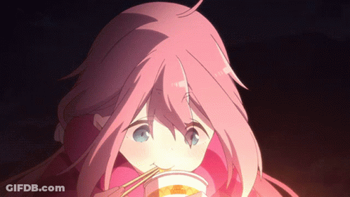 A Girl With Pink Hair Is Eating A Cup Of Food With Chopsticks GIF