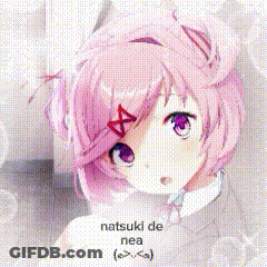 A Girl With Pink Hair Is Giving A Peace Sign In A School Classroom . GIF