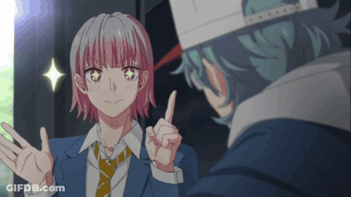 A Girl With Pink Hair Is Giving A Peace Sign To A Man GIF