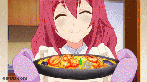 A Girl With Pink Hair Is Holding A Pan Of Food And Smiling . GIF