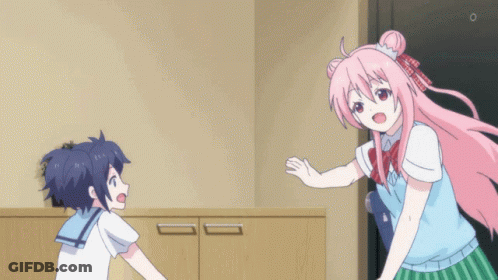 A Girl With Pink Hair Is Hugging Another Girl In A Room GIF