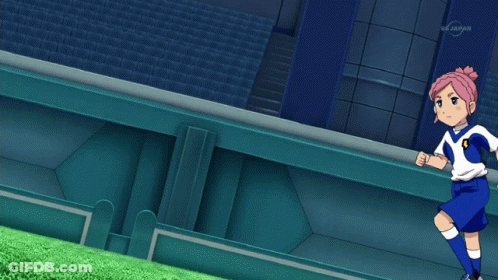 A Girl With Pink Hair Is Kicking A Soccer Ball On A Tv Screen That Says Tv Japan GIF